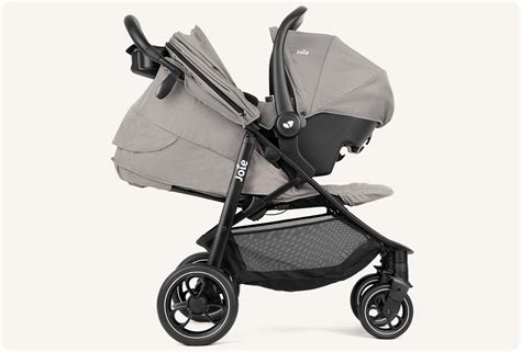 Illustration verschiedener Ersatzteile für den Joie Litetrax Pro Air Kinderwagen, wie Räder, Gurte und Bezüge.