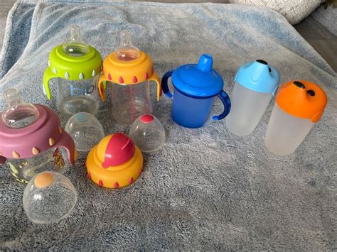 Collage aus verschiedenen NUK Babyflaschen, Trinklernflaschen und dem Magic Cup.