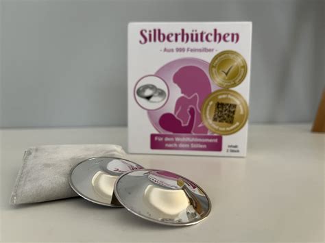 schematische Darstellung von Silberhütchen, die auf einer Brustwarze platziert sind