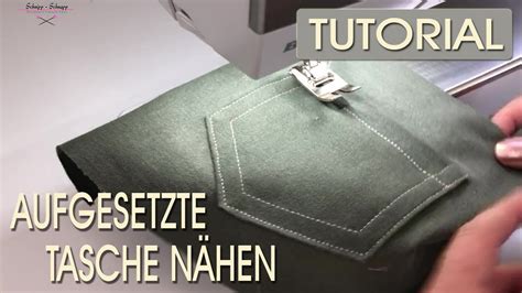 Nahaufnahme einer aufgenähten Applikation auf einem Stoffquadrat