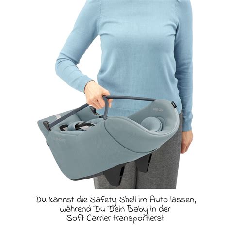 Illustration einer Weber Babyschale mit einem Baby darin, befestigt in einem Fahrradanhänger