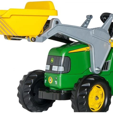 Nahaufnahme eines detailreichen Trettraktors mit Frontlader und Anhänger.