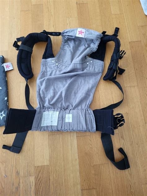 Schema des Kokadi Flip mit Erläuterung der Schnallen und des Rückenteils